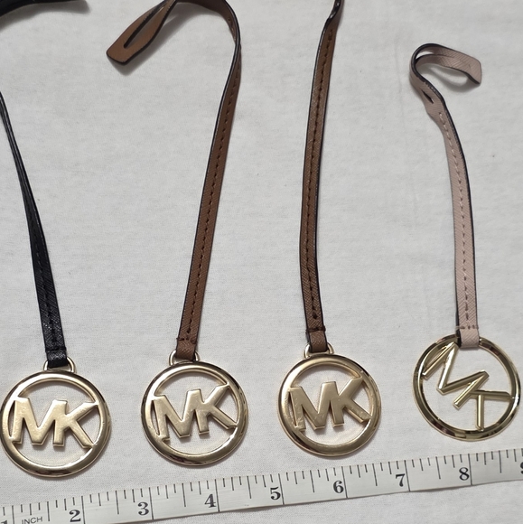 Michael Kors Handbags - Michael Kors Medium Gold Logo Hangtag